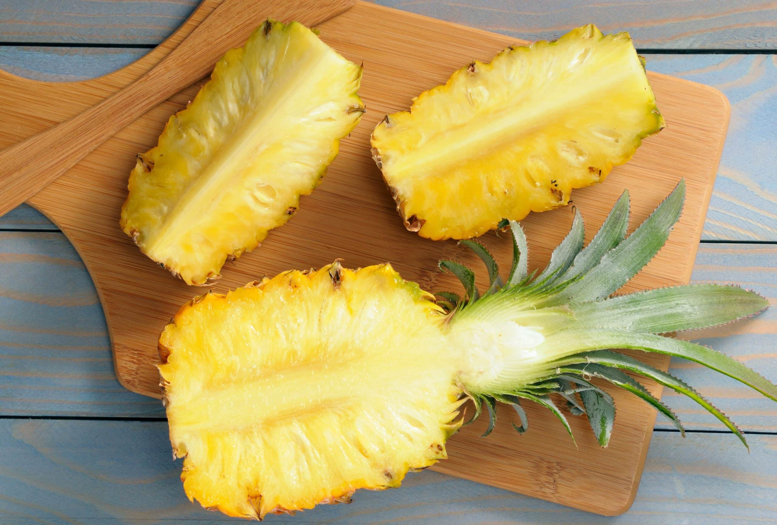 bhg slicing a pineapple on a woo scaled 1