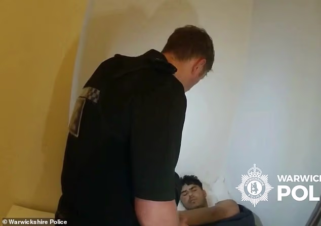 106132553 15684395 mulakhil is arrested in his bed after police entered the house o a 12 1774606794189