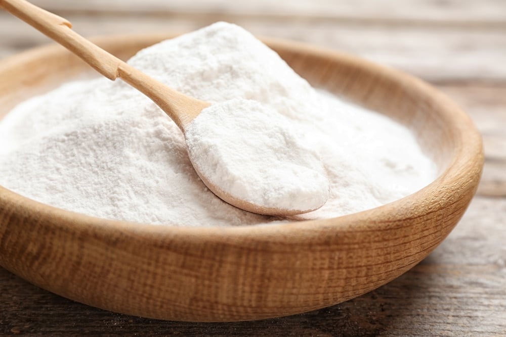 baking soda on wooden table new africa shutterstock