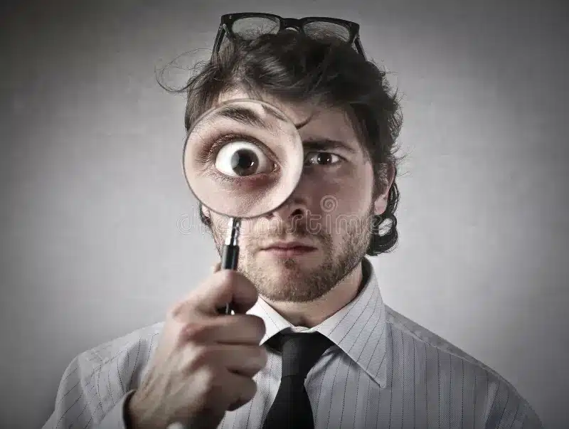 looking closely portrait man magnifying glass 52331963