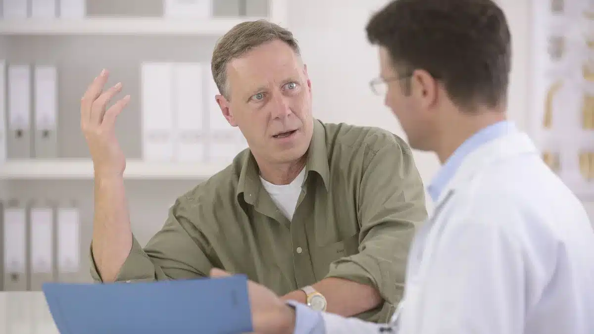 37aa7030 bigstock doctor talking to mature male 34397057