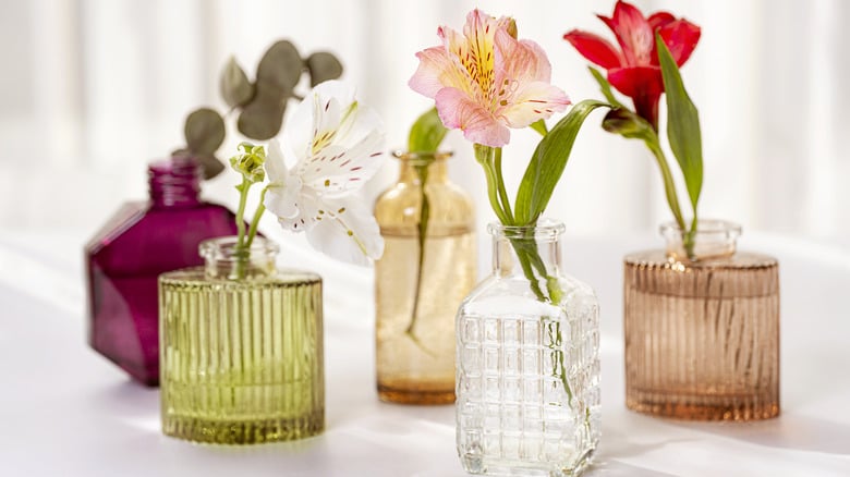 repurposing perfume bottles as vases 1732657743