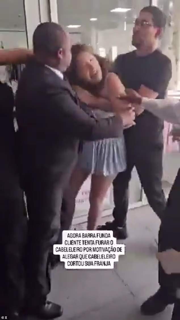 108437347 15797817 in this video grab a hairdresser hits da cunha as she is held by a 19 1778152017755