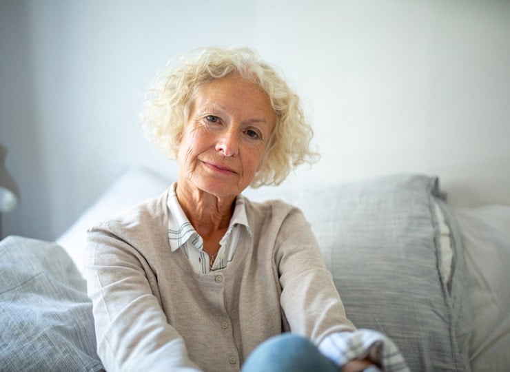 close up elderly woman relaxing at home