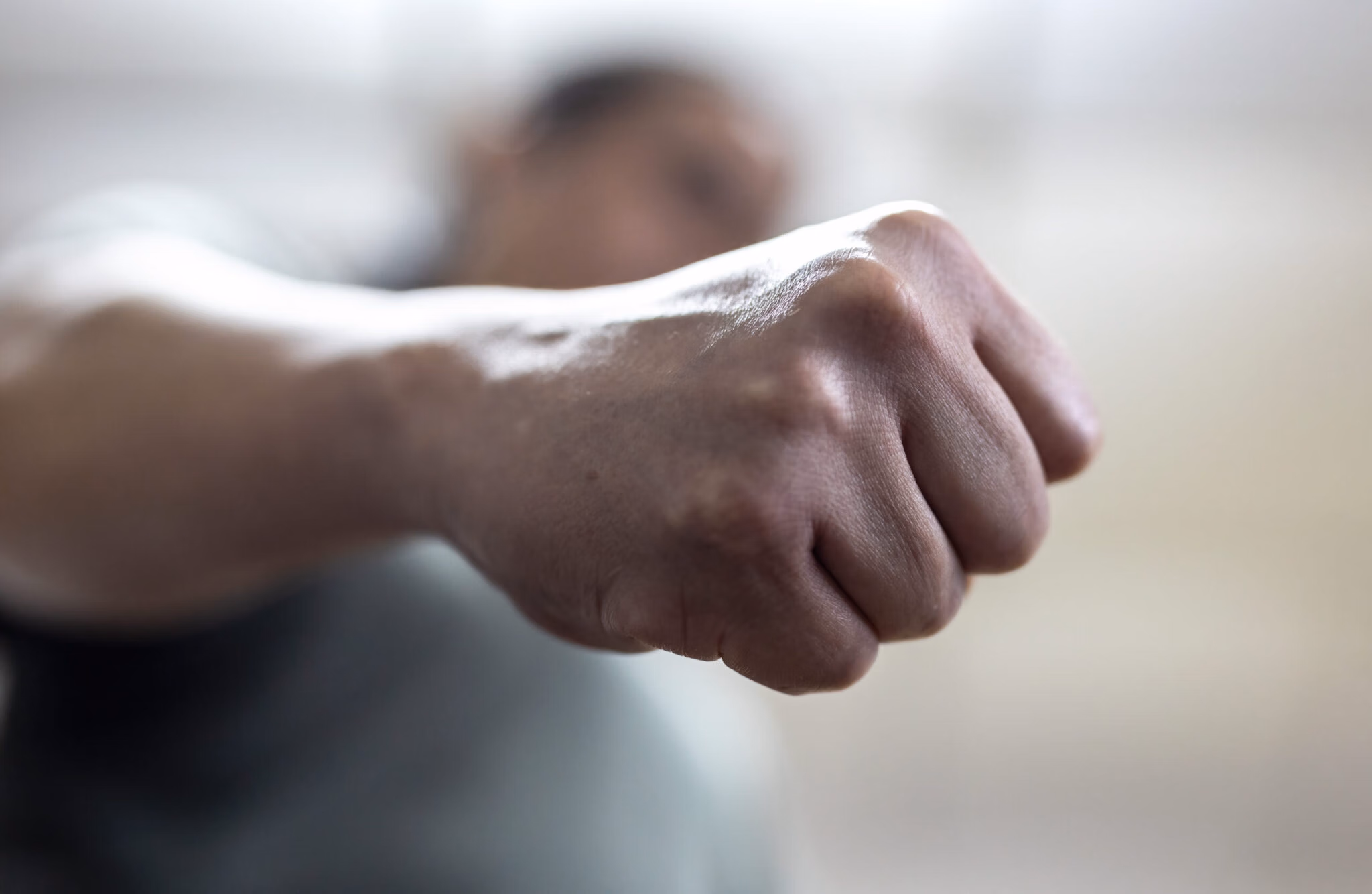 the angry man clenched his fist 2048x1334 1