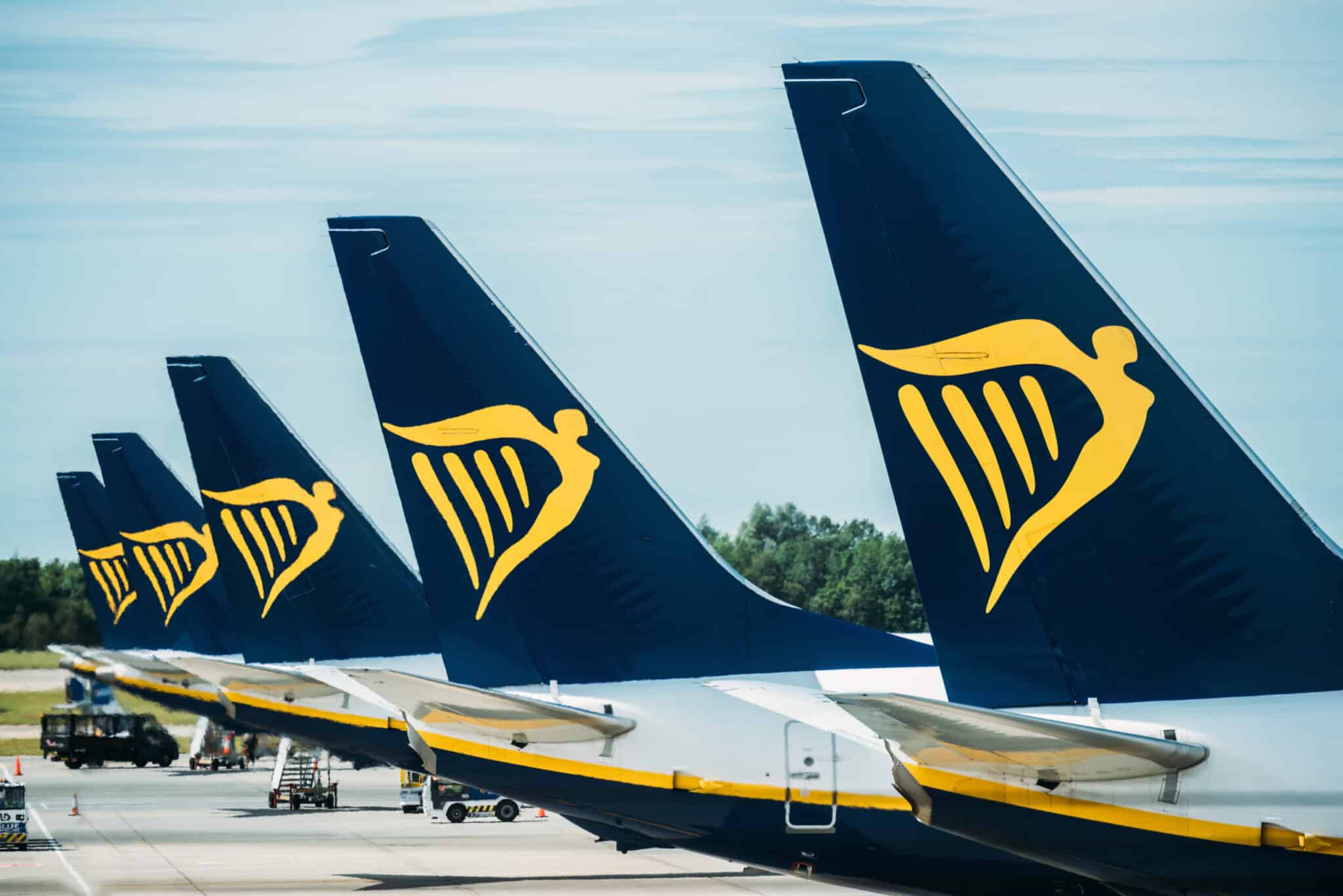 a row of airplanes belonging to ryanair parked at the tarmac at stansted airport london uk 2048x1367 1