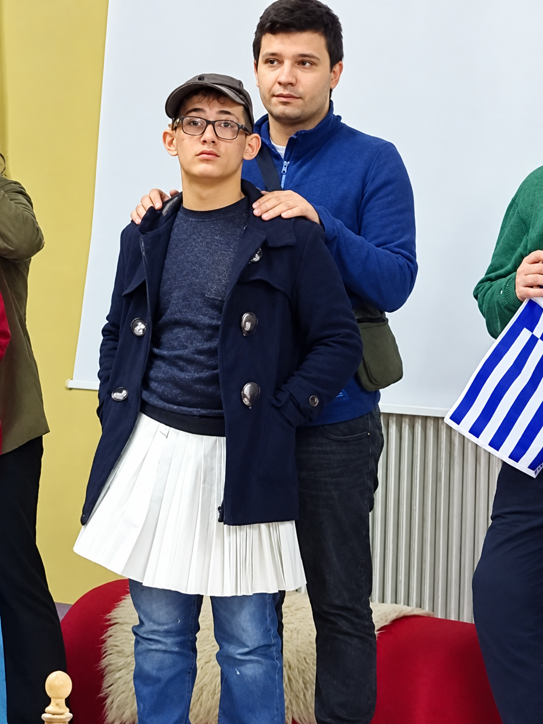 candid portrait of two men in a hall
